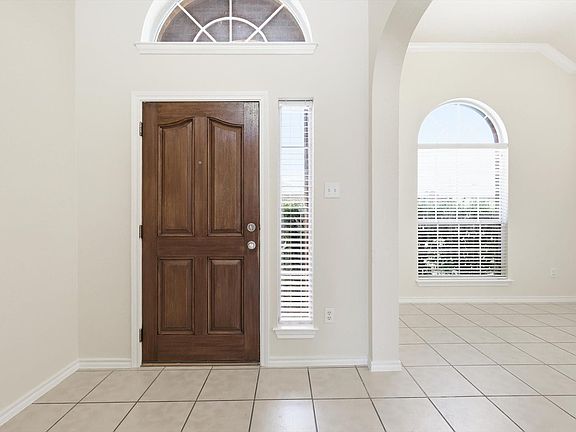 Impressive entry. Light & bright colors. As you walk in, the dedicated dining area to the left.