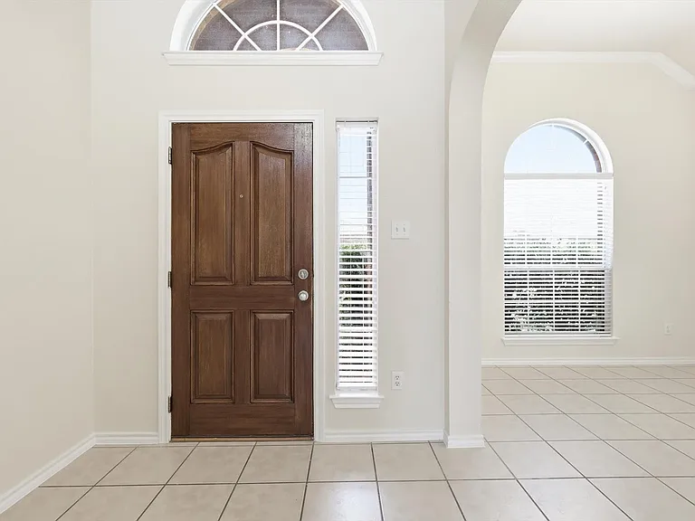Impressive entry. Light & bright colors. As you walk in, the dedicated dining area to the left.