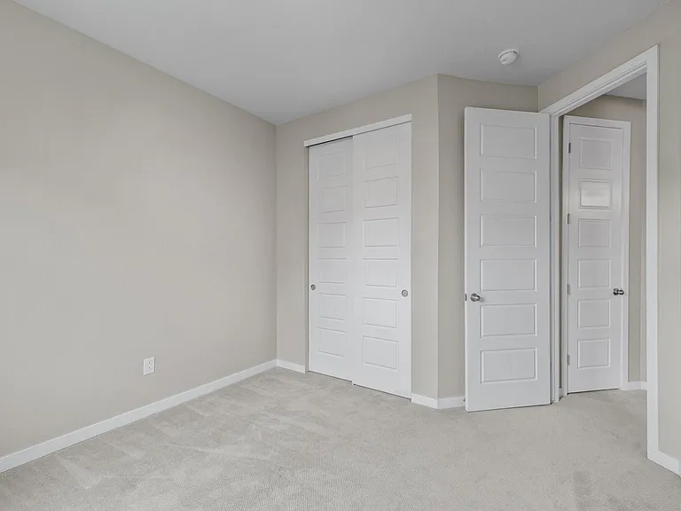 Bedroom #2 with custom closet system