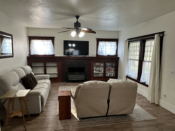 Family Room with 2 reclining couches, fireplace, and large TV with internet provided.