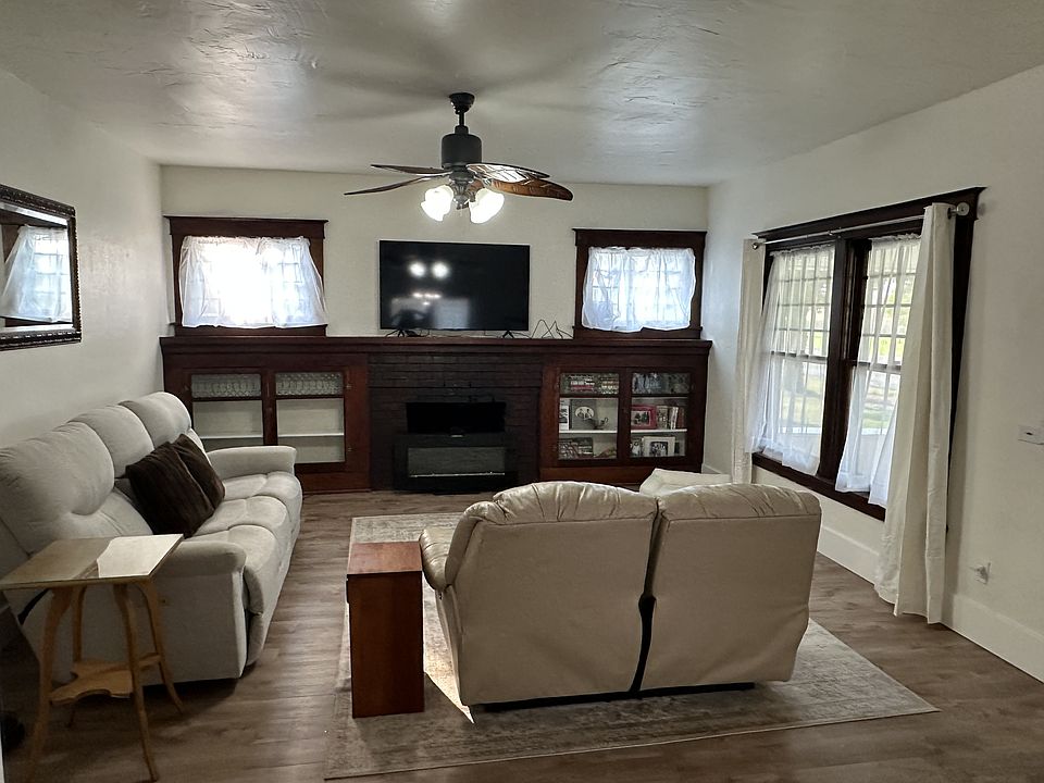 Family Room with 2 reclining couches, fireplace, and large TV with internet provided.
