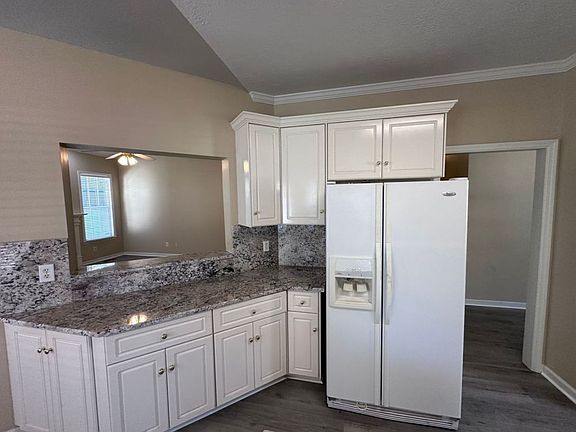 Bar opens into the informal living room.