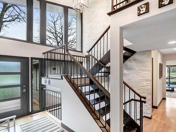 DRAMATIC OPEN STAIR-CASE ENTRY.