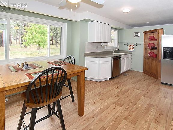 The kitchen includes two work spaces, each of which has its own sink