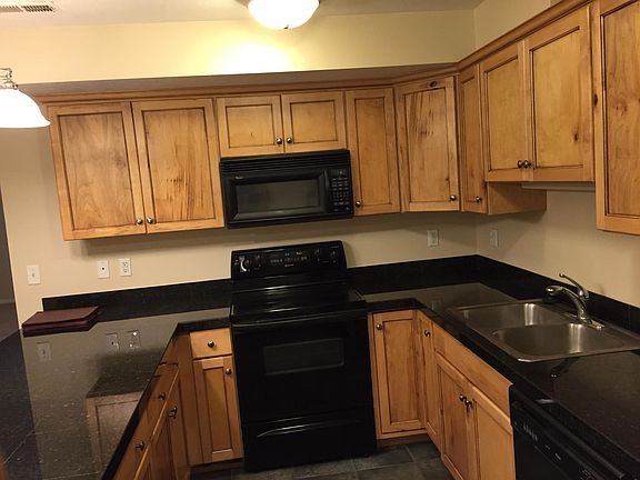 Lots of cabinets and granite counter top