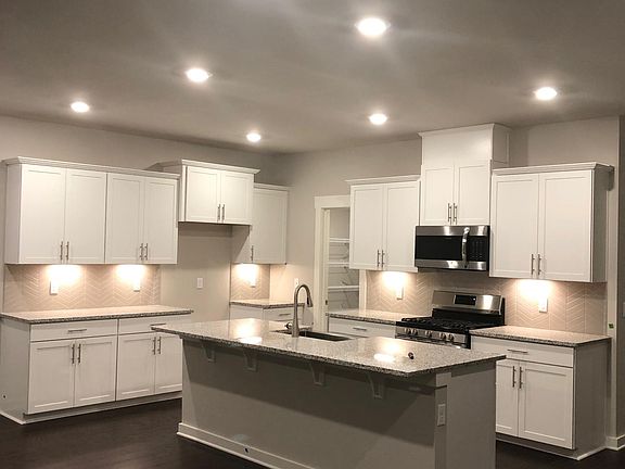 Open kitchen, large walk-in pantry, breakfast bar. Refrigerator included! (Not pictured)