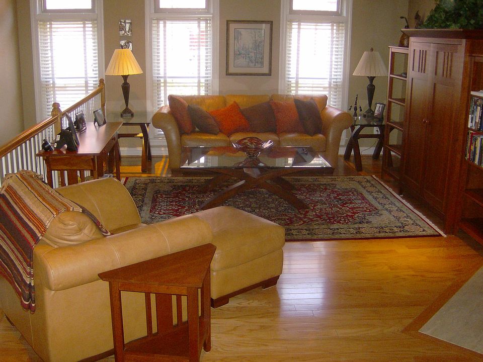 Living Room with custom window coverings and recessed ceiling lites.