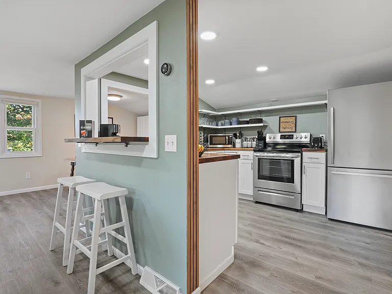 Barstool seating off the kitchen breakfast bar
