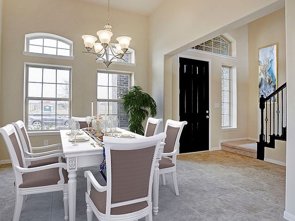 Dining room tucked off foyer