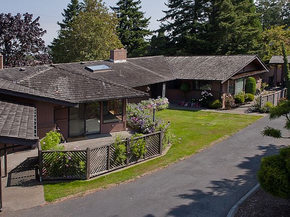 Approx. 2500 SF of living with multiple garages & patios
