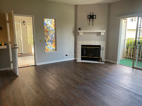 Front entry, living room, fireplace and patio