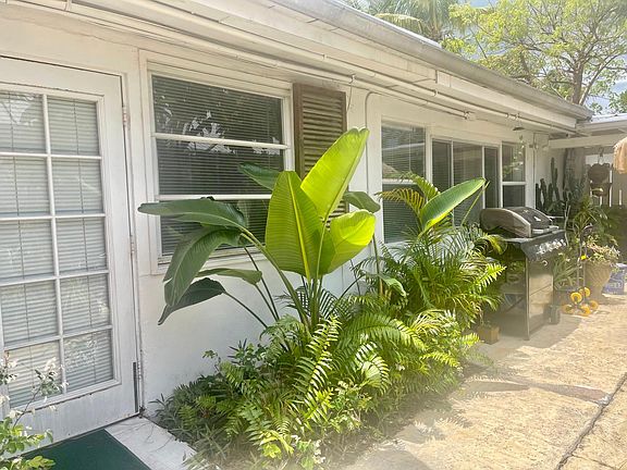 Door off living room onto gorgeous tropical shared patio