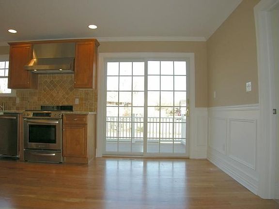 Eat-In Area of Kitchen with Sliders to Deck & Backyard