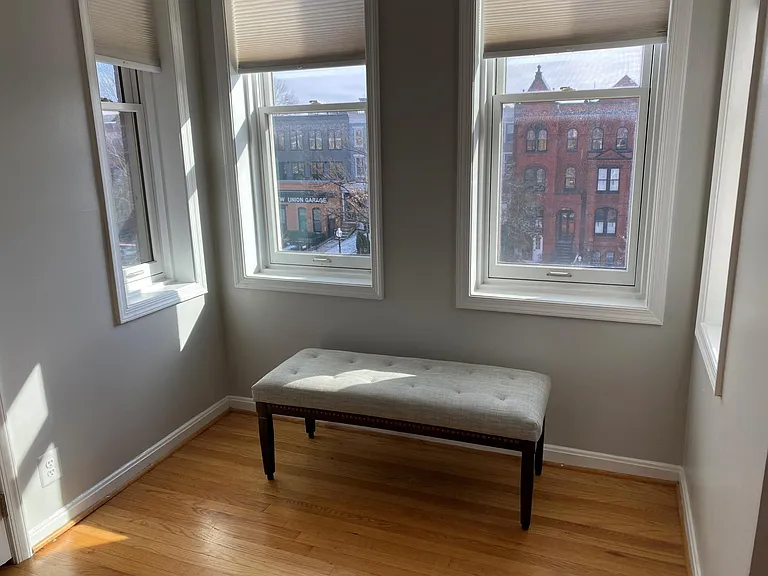 Bright sitting are in master bedroom. Chaise lounge is here now.