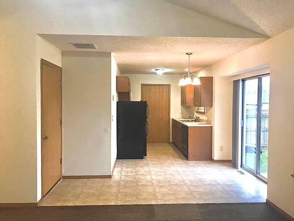 Dining/Kitchen area. Pantry/Laundry through door facing you.