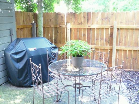 Fenced in patio with Storage unit