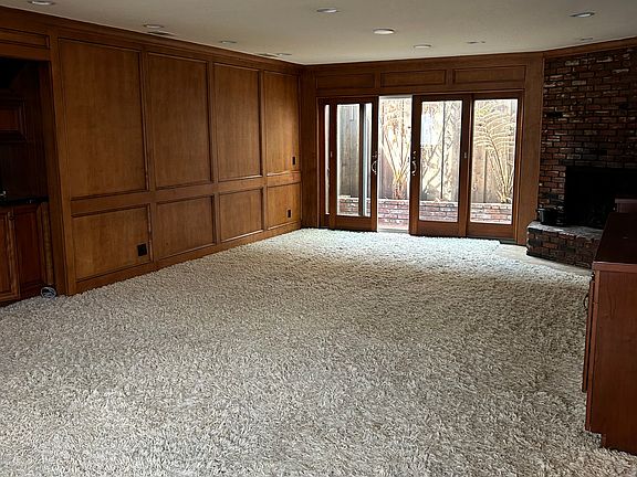 Living room and sliding doors to small patio.
