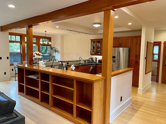 Kitchen overlooking living room and dining area
