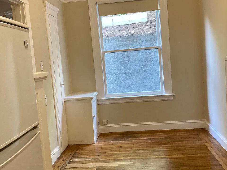 Taken from the kitchen. Area for small dining table.