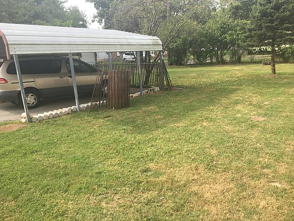 Carport and back yard--will be fenced completely on September 11