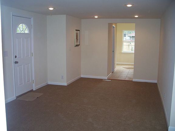 Family room w/new carpet, recessed lighting and prewired for surround sound
