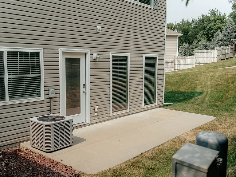 Step outside onto your private patio on south side. Trees add privacy,