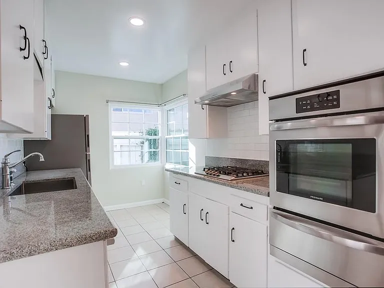 Kitchen with new appliances and breakfast nook. Lots of cabinet space and light.