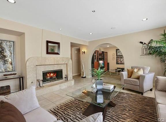 Family Room with Fireplace and One of 12 Sets of Speakers with I