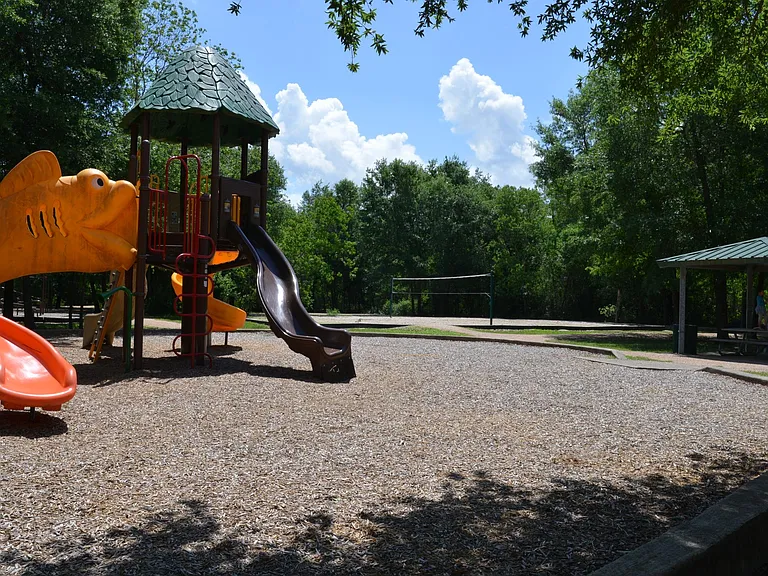 City park across the street with splash pad and playground