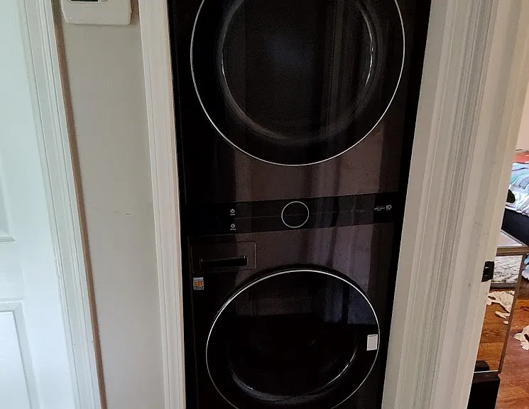 Washer and Dryer located in hallway.
