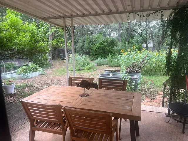 Back yard deck with over head cover. Great view of yard and lots of privacy.
Peaceful setting.