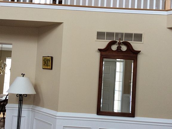 Two level foyer with custom wains coating