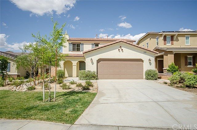This gorgeous home is located on a cul-de-sac and features mature landscaping.