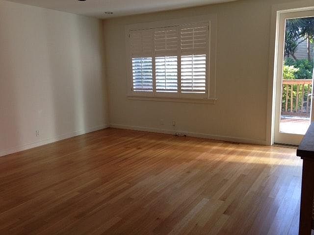 Living area facing south, kitchen on the right. Open floor plan - great room.