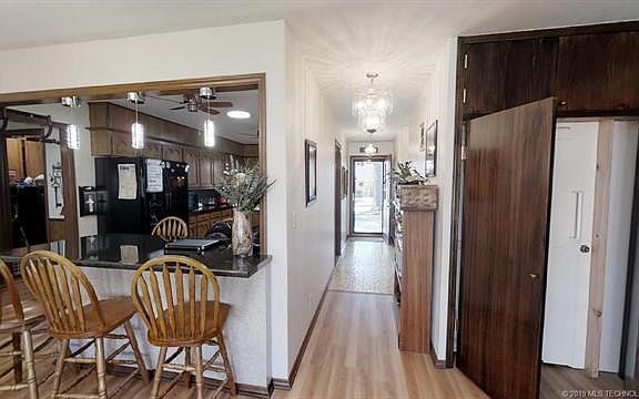 When you walk in the front door, the kitchen is to your right and leads to the dining room and living room, there is a hallway to the left that leads to bedrooms. Note the indoor family safe room in case of tornado warnings.