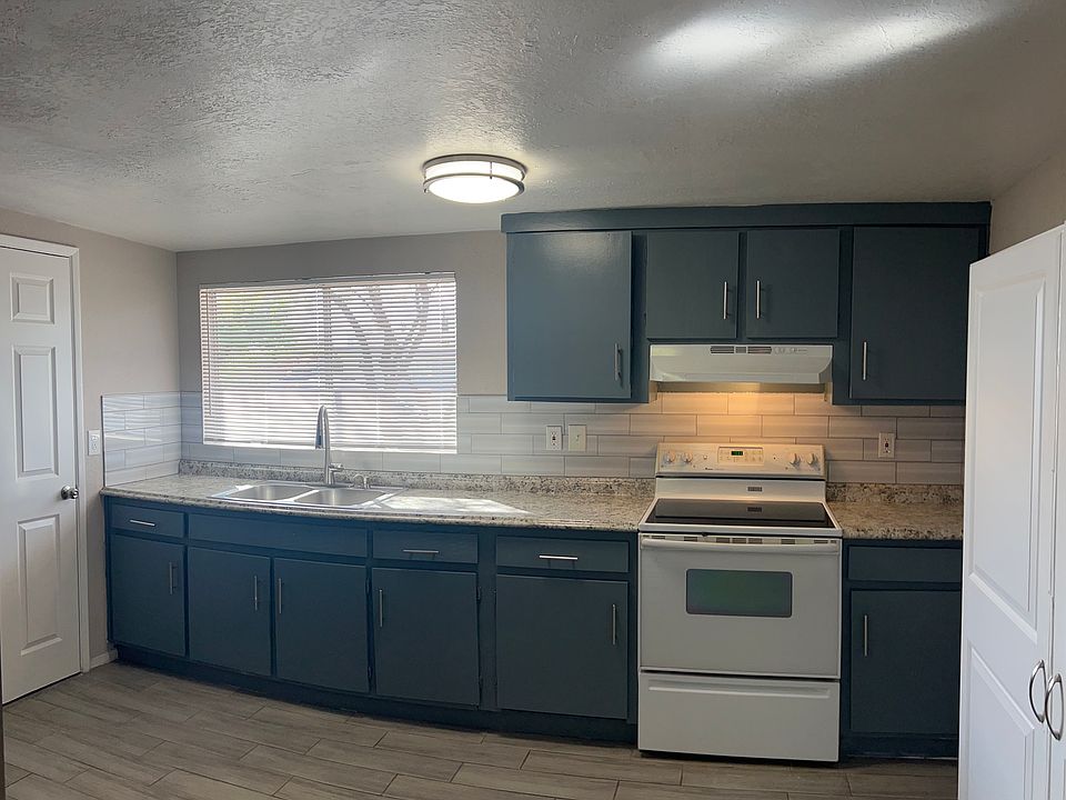 Full kitchen with electric stove/oven, full size refrigerator and a wall pantry. The storage and laundry room is adjacent the kitchen with hookup's for your own washer and dryer.