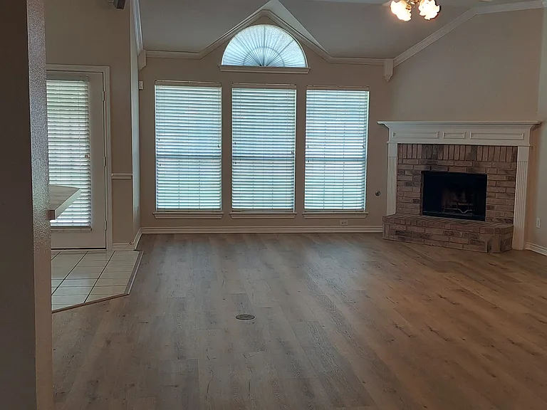 Entrance to living area with luxury vinyl tile flooring installed 7/20/2026