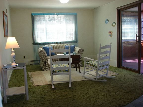 living room leads to sunroom