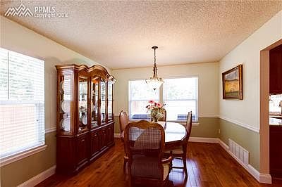 SEPARATE DINING ROOM WITH WOOD FLOORS
