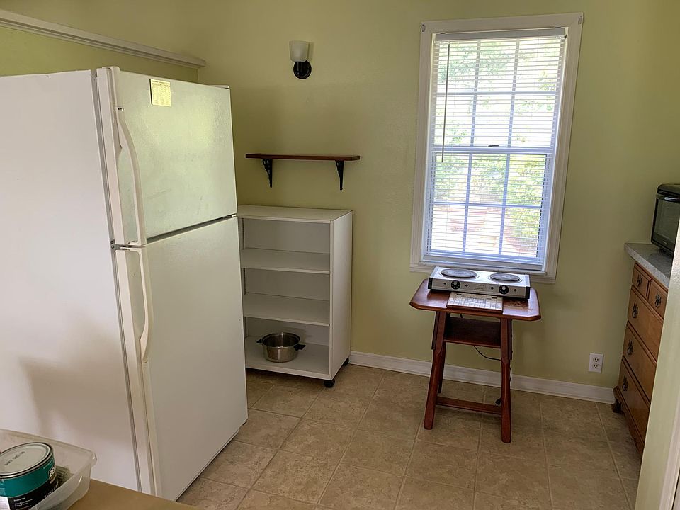 Refrigerator plus large convection oven, microwave, and 2 burner professional grade hot plate. Sink in bathroom is a double sink...one side for dish drain