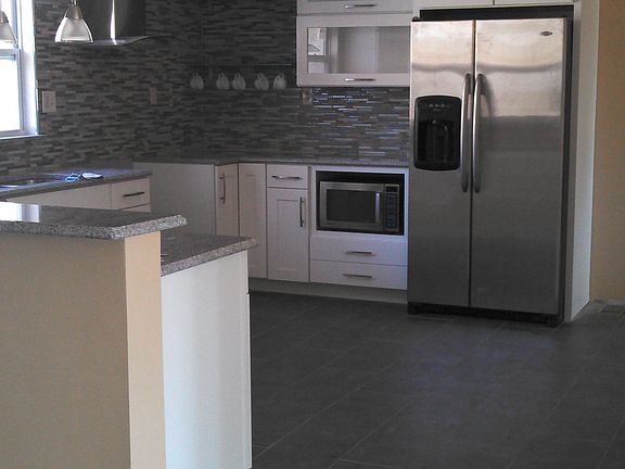 Kitchen view (frig and micro