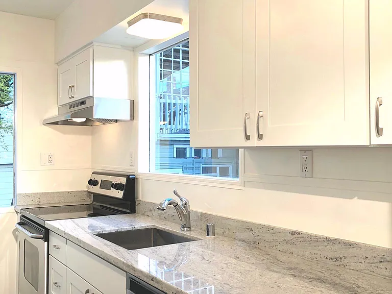 Beautifully remodeled kitchen with stainless steel appliances.