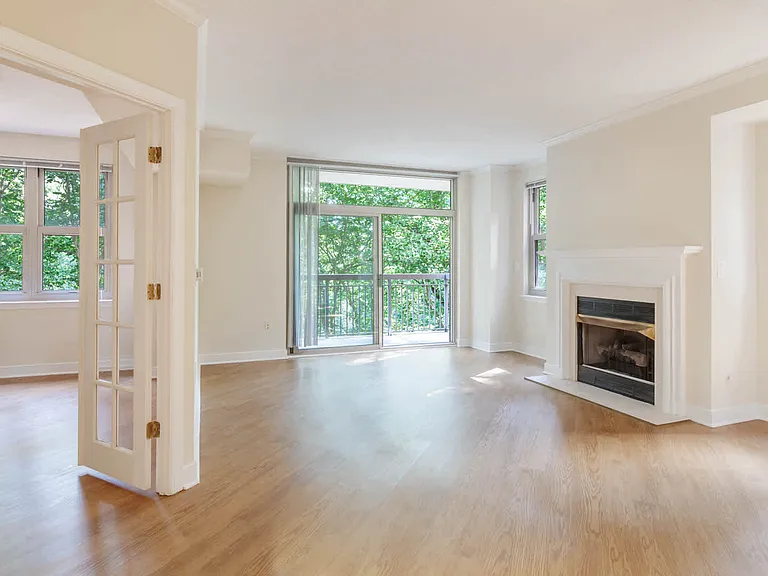 Living Room with Fireplace and Balcony