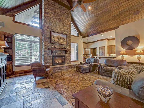 No family room is complete without a fireplace. This magnificent stone fireplace will be a staple in your family gatherings!