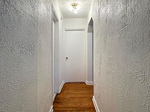 Bedroom #2 straight ahead. 
Main bathroom to the left.
Kitchen and exit to the right.