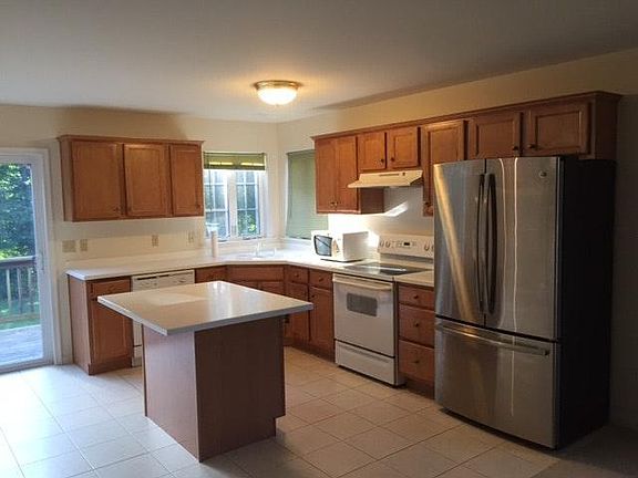 kitchen with new stainless steel fridge