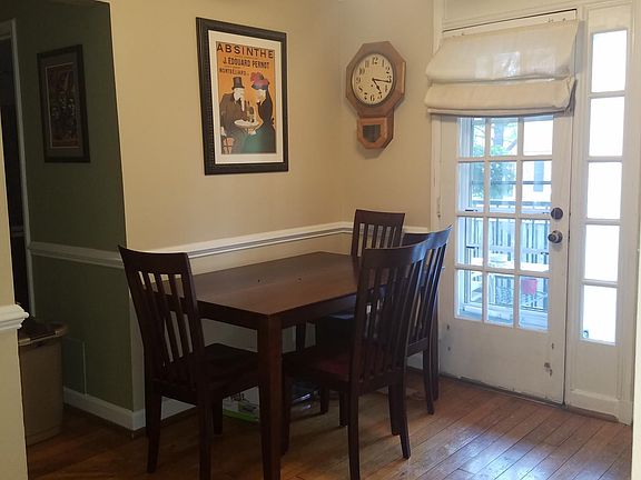 Dining area with door to back deck and backyard (floors have SINCE BEEN COMPLETELY SANDED AND REFINISHED)