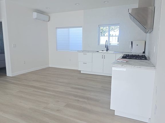 Kitchen And dining Room
Open dining area with 18,000 BTU A/C, bright LED recessed lighting, and waterproof LVP flooring. Clean, modern space with great natural light_perfect for everyday dining and entertaining.