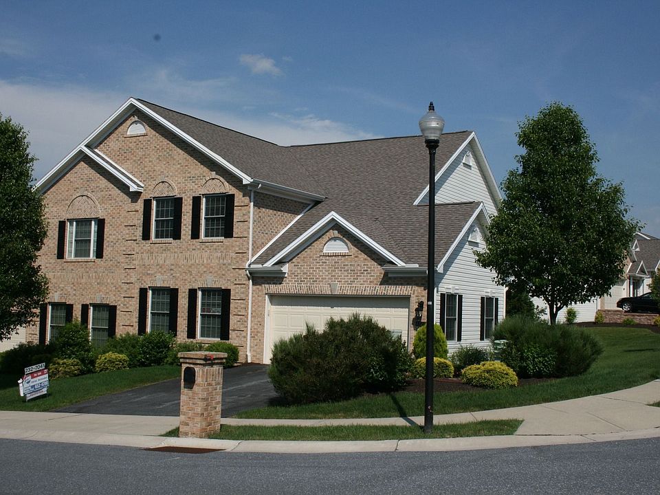 Beautiful brick and vinyl exterior on a corner lot.