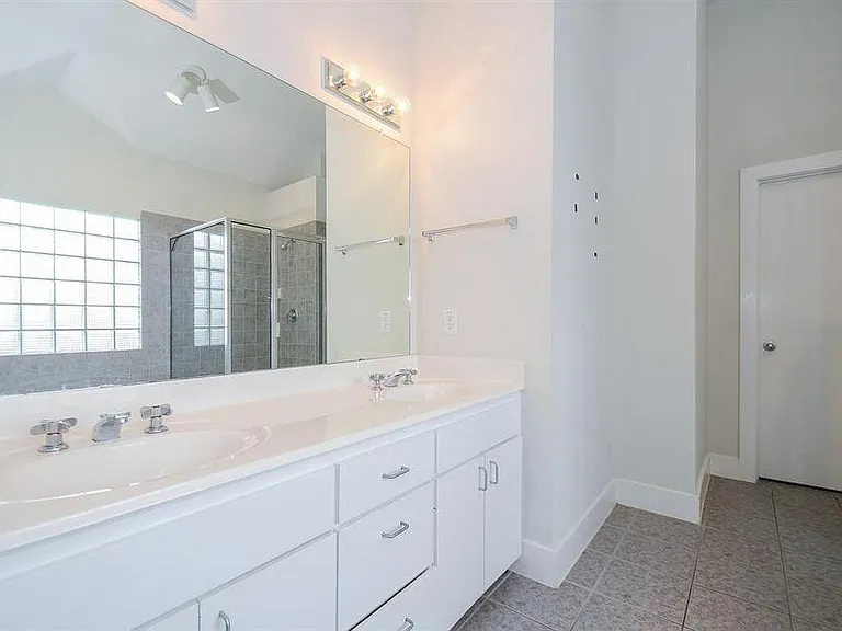 Plush master bathroom with two sinks